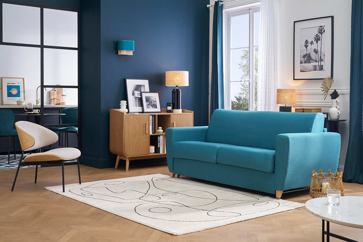 Canap convertible bleu canard 3 places, vue de face, dans un salon moderne.