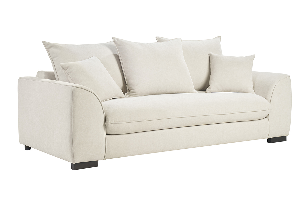 Canap convertible beige 3 places en tissu effet velours, vue de 3/4 avec coussins.