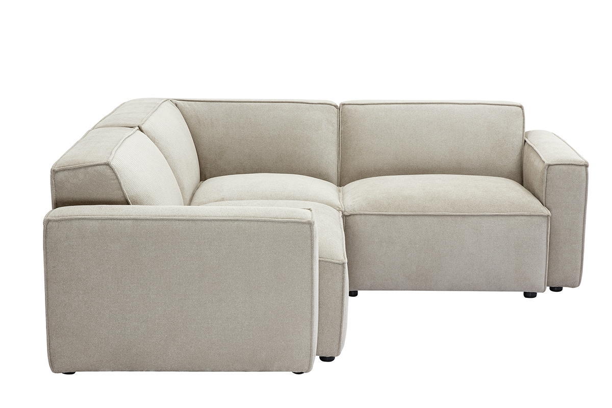 Canap d'angle modulable 3 places en tissu effet velours beige, vue de ct.