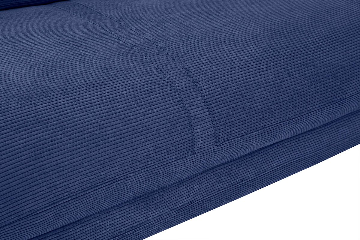 Gros plan sur le tissu velours ctel bleu fonc de la chauffeuse SPENCER.