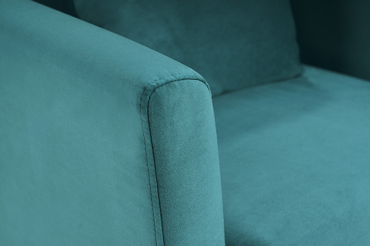 D�tail du tissu velours bleu p�trole d'un fauteuil, vue rapproch�e.