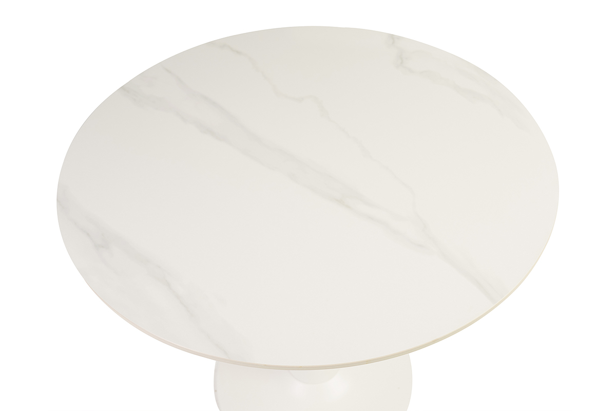 Table ronde en cramique blanche vue du dessus.