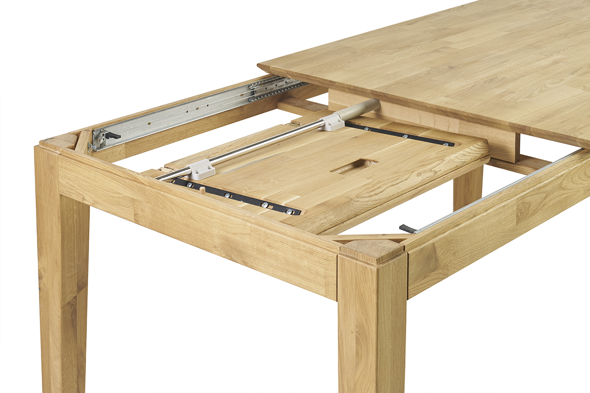 Table extensible en bois clair vue en dtail montrant le systme coulissant.