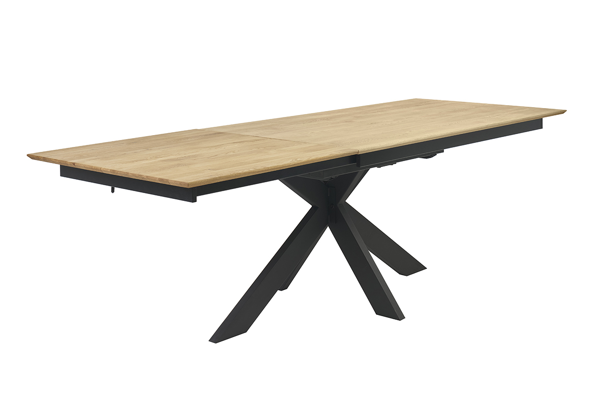Table  manger extensible en bois clair chne massif avec pitement crois noir, vue de 3/4.