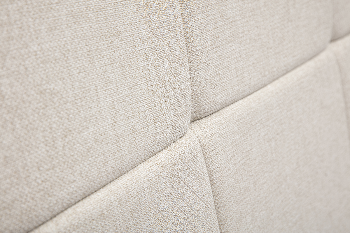 Gros plan sur le tissu beige crme capitonn de la tte de lit CLOVIS.